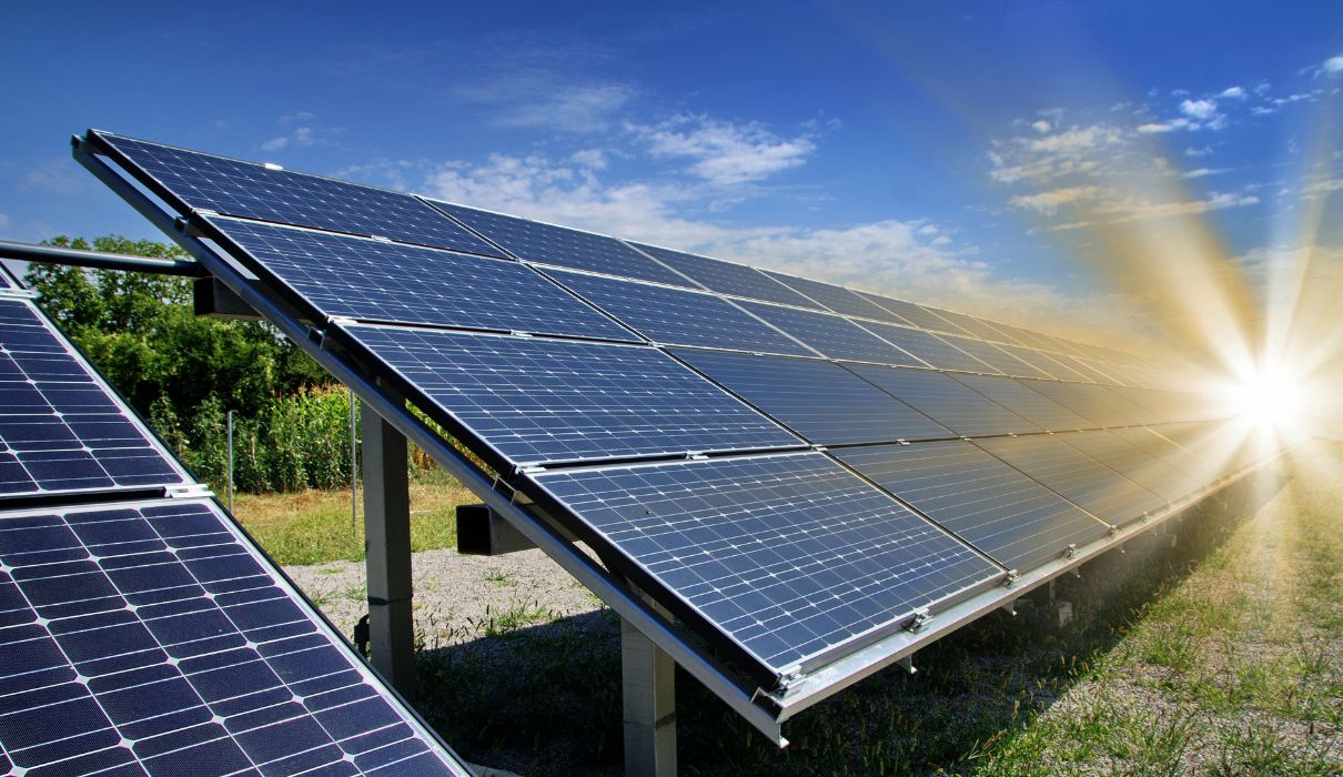 Solar panels reflecting a clear blue sky